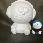 Alcancia Doraemon con audifonos
