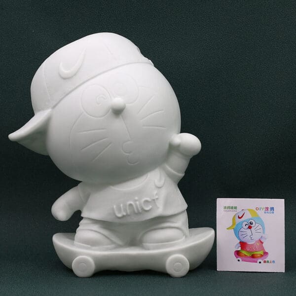 Alcancia Doraemon con patineta