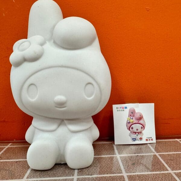 Alcancia Melody  sentada